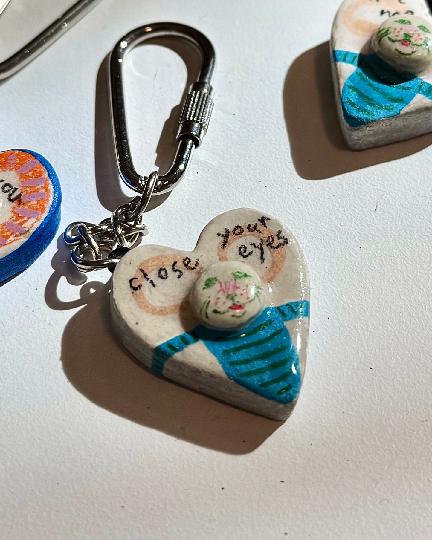 ‘Close your eyes’ Keychain